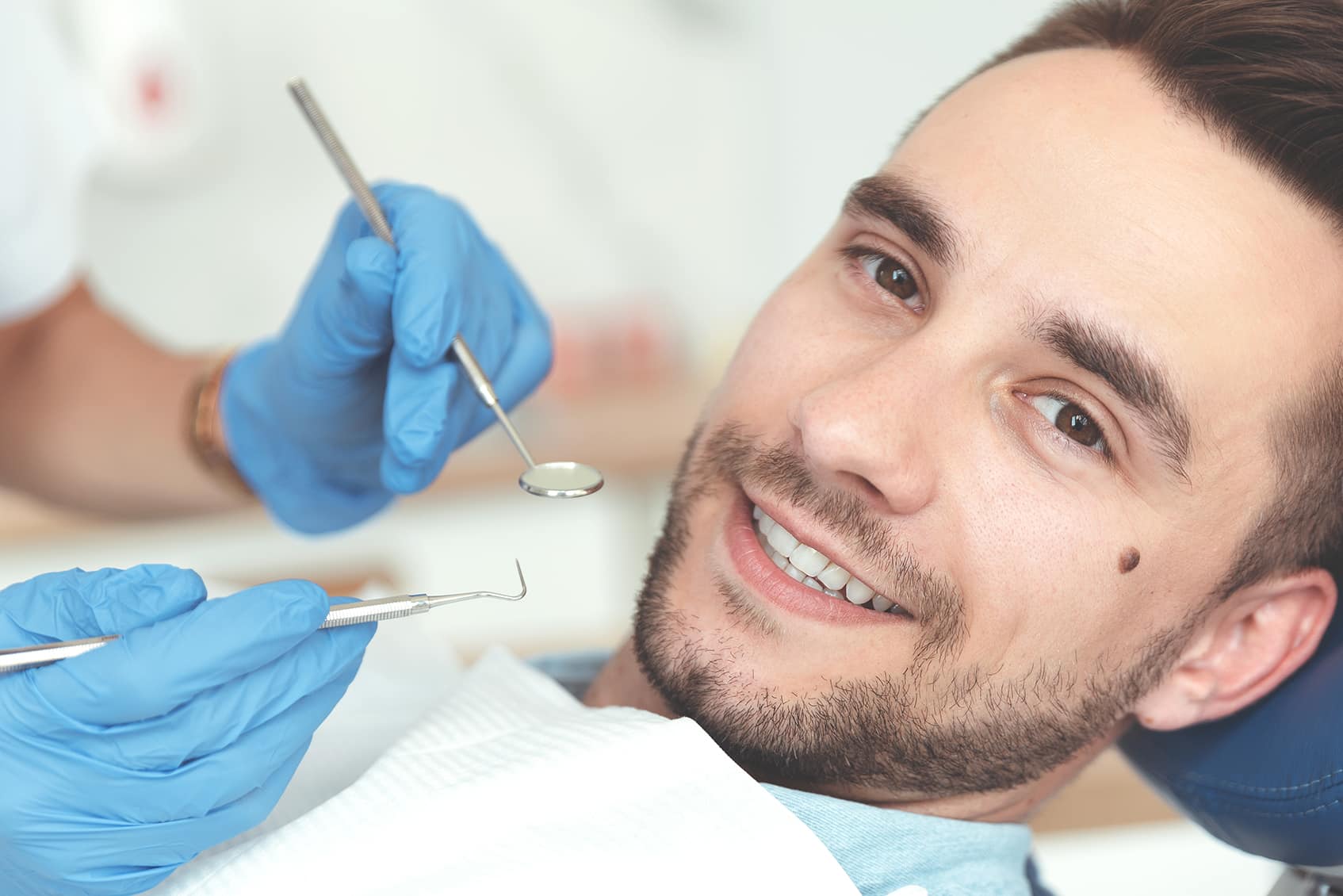 man getting a cavity filling from luminous dental