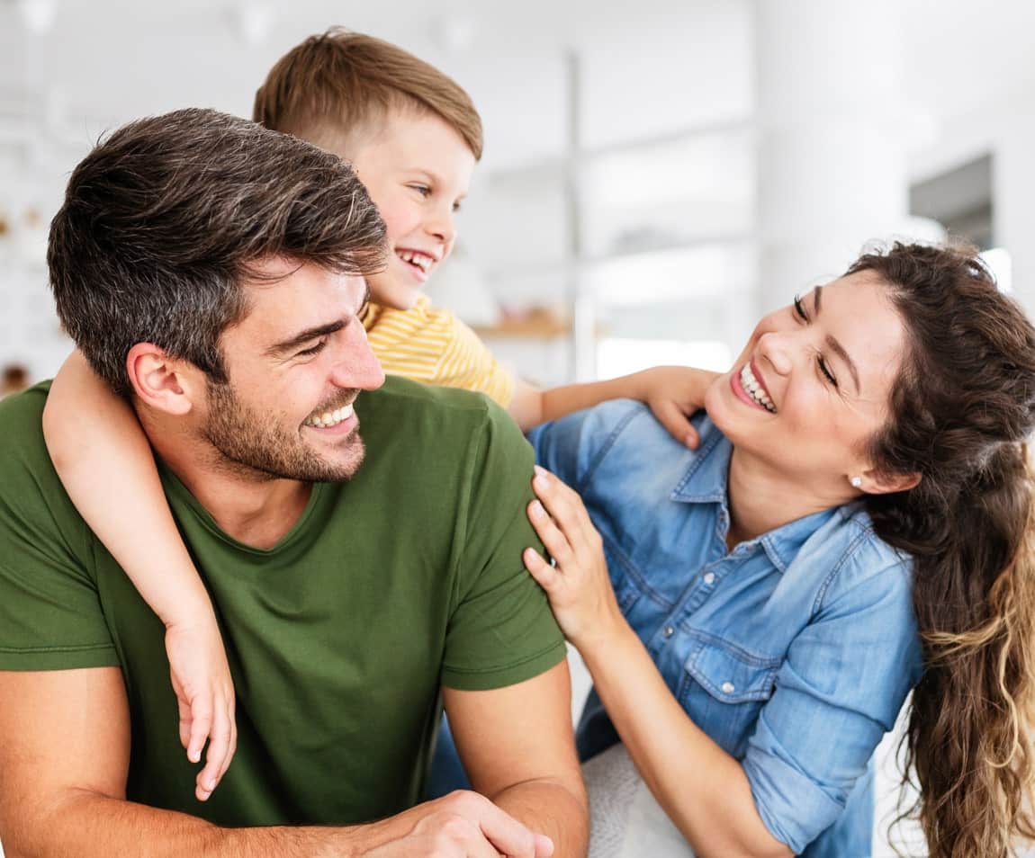 A-Fresh-Take-On-Dentistry smiling family on rustic bridge
